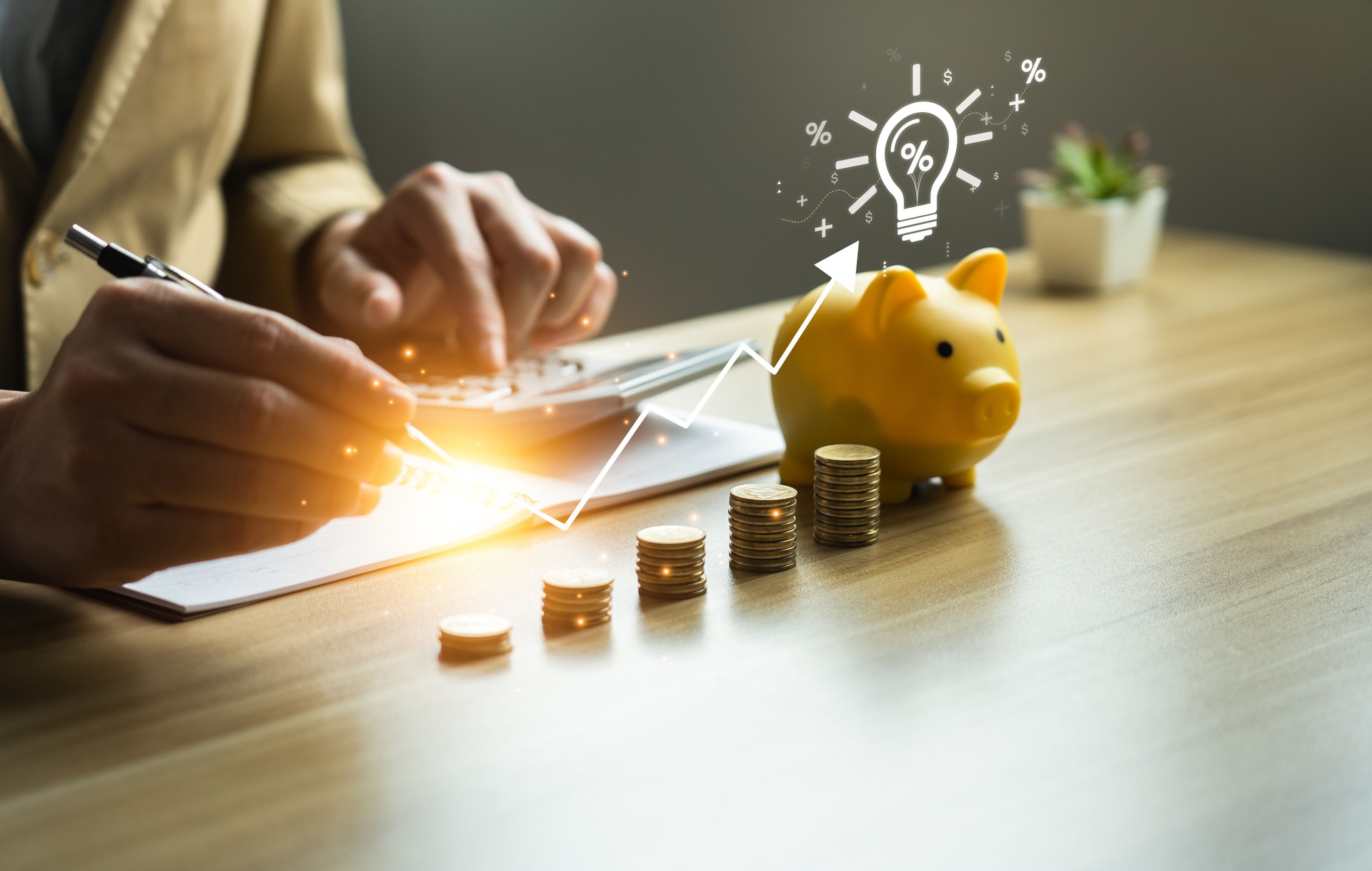 interest rates and dividends, investment returns, income, retirement Compensation fund, investment, dividend tax. Piggy bank and pile of coins and the plus percent symbol. saving money for investment